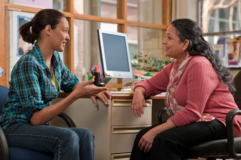 Two women having a health coaching session.