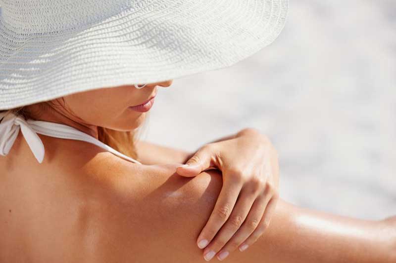 Photo of woman baring her skin in the sun.