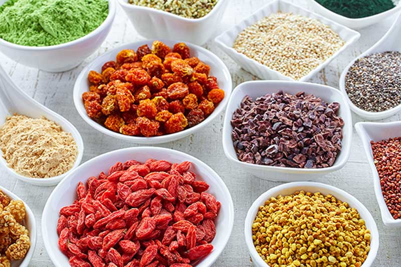 Photo of separate bowls containing different food ingredients.