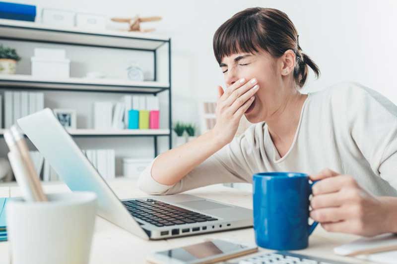 Photo of a woman yawning.