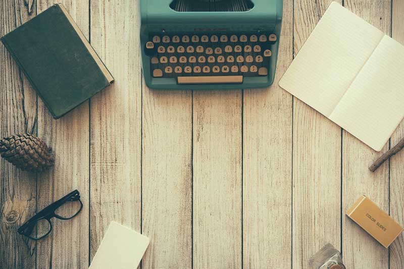 Photo of a typewriter on a desk.