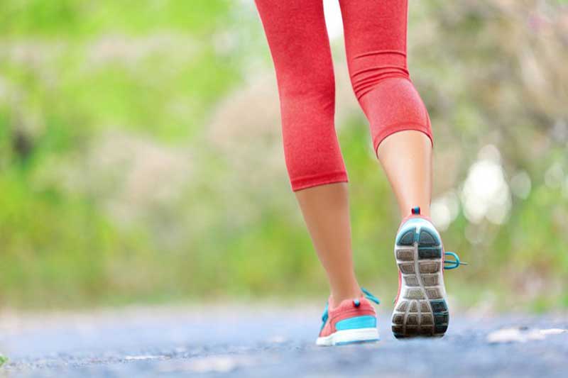 Photo of a woman walking.